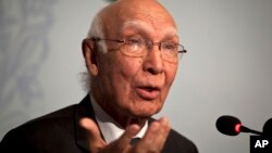 FILE - Pakistan’s National Security Adviser Sartaj Aziz gestures during a press conference in Islamabad, Pakistan, Aug. 22, 2015.