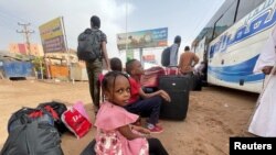 People flee clashes between the paramilitary Rapid Support Forces and the army in Khartoum