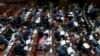 Members of Egypt's panel tasked with amending Egypt's Islamist-drafted constitution, read drafts of the constitution before they begin voting on a series of amendments, Cairo, Nov. 30, 2013. 