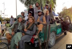 ژمارەیەک چەکداری گەنجی تاڵیبان لە شاری قەندەهار، 15 ی مانگی هەشتی 2021