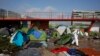 Paris Police Clear Out Migrant Camp at Center of Debate