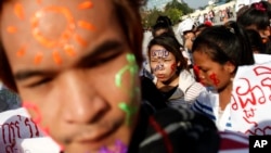 FILE - Garment workers attend a march on the streets to mark International Labor Day in Phnom Penh, May 1, 2013.