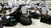 FILE - North Korean workers assemble Western-style suits at the South Korean-run ShinWon Corp. garment factory inside the Kaesong Industrial Complex in Kaesong, North Korea.