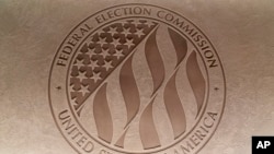 FILE - The Federal Election Commission emblem is seen at the FEC headquarters in Washington on Aug. 10, 2023. The FEC oversees election spending, including that of political action committees.