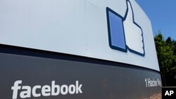 FILE - A sign is shown at Facebook headquarters in Menlo Park, Calif. 