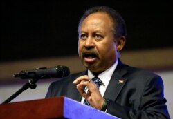 FILE - Sudan's Prime Minister Abdalla Hamdok speaks inside Friendship Hall in Khartoum, Sudan Dec. 25, 2019.