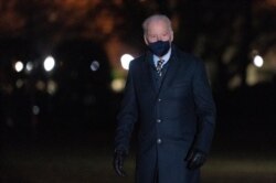 President Joe Biden walks on the South Lawn of the White House after stepping off Marine One, Feb. 17, 2021, in Washington.