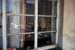 FILE - Sibongile Zulu is seen in her home in Johannesburg, South Africa, July 28, 2020. Zulu is HIV-positive and has had trouble getting medication. Around the world, the COVID-19 pandemic has disrupted the supply of antiretroviral drugs.