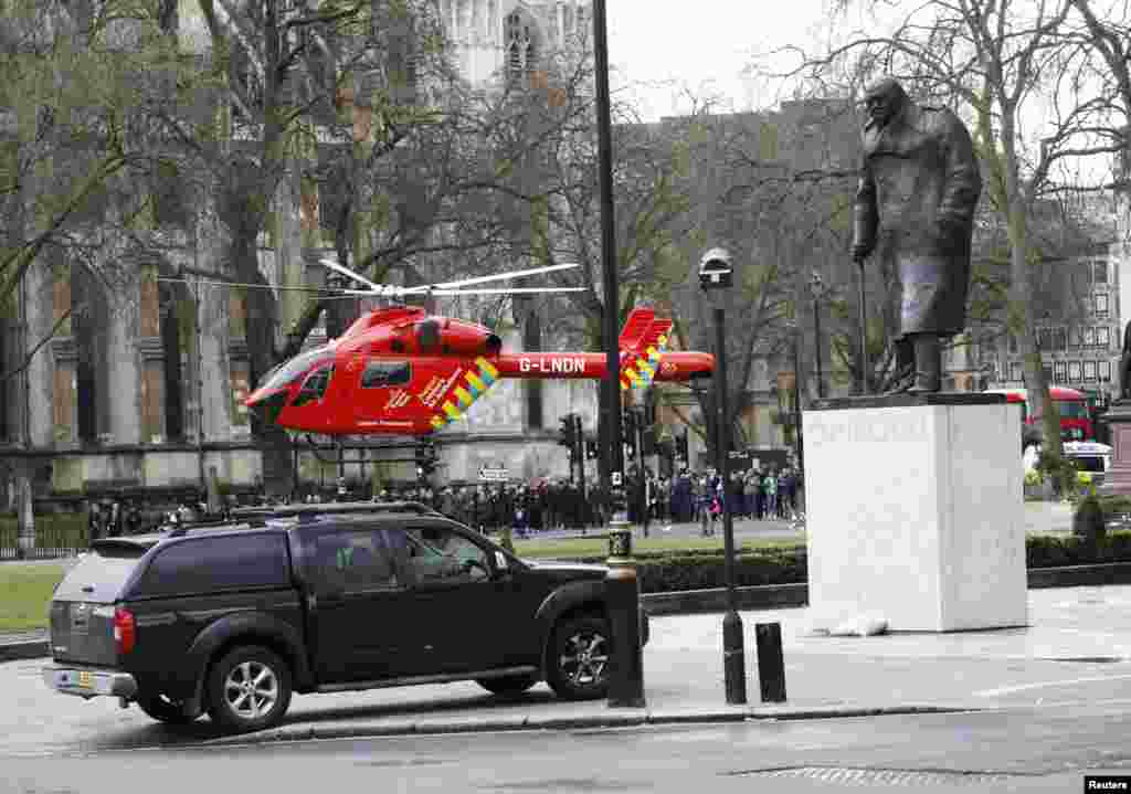 An air ambulance lands in Parliament Square during an incident on Westminster Bridge in London, Britain March 22, 2017.