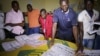Electoral officials sort out ballot papers at the end of presidential elections in Conakry, Guinea, Oct. 11, 2015. 