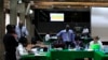 FILE - Election clerks go through the retallying of votes after the Kenya Supreme Court issued an order related to a presidential poll petition in Kenya's capital, Nairobi, March 26, 2013.