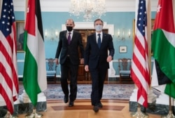 US Secretary of State Antony Blinken (R) and Jordanian Foreign Minister Ayman Safadi (L) arrive to speak the media prior to a meeting at the State Department in Washington, May 10, 2021.