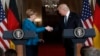 President Donald Trump and German Chancellor Angela Merkel shake hands at a joint news conference in the East Room of the White House in Washington, March 17, 2017.