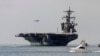 FILE - The USS Carl Vinson sails out of San Diego Harbor, Aug. 22, 2014.