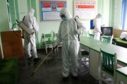 Offices at the Pyongchon District People's Hospital are disinfected, in Pyongyang, North Korea, April 1, 2020.