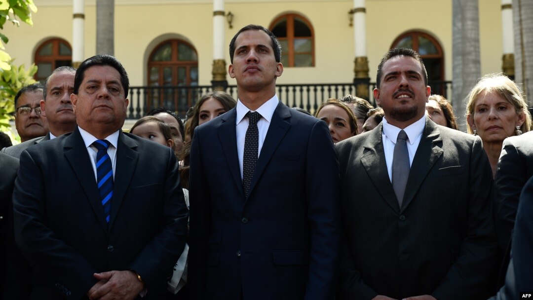 The new president of Venezuela's National Assembly, Juan Guaido, center, First Vice President Edgar Zambrano, left, and Second Vice President Stalin Gonzalez are pictured after the inauguration ceremony in Caracas, Jan. 5, 2019. 