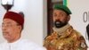 FILE - Colonel Assimi Goita, leader of Mali's military junta, stands behind Niger's President Mahamadou Issoufou during a photo opportunity after the Economic Community of West African States consultative meeting in Accra, Ghana, Sept. 15, 2020.