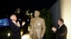 U.S. Ambassador in Germany Richard Grenell, right, and Secretary of State Mike Pompeo unveil a statue of former President Ronald Reagan on the top of United States embassy in Berlin, Nov. 7, 2019. 