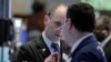 Traders work on the floor of the New York Stock Exchange in New York City, May 25, 2016.