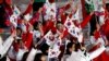 Para atlet dari dua negara Korea Utara dan Korea Selatan berpartisipasi dalam upacara penutupan Olimpade Musim Dingin 2018 di Pyeongchang pada 25 Februari 2018. (Foto: Reuters/Damir Sagolj)