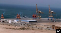 FILE - A Pakistan Navy ship berths at Gwadar port, Pakistan, April 11, 2016. The facility is seen as central to a multi-billion dollar economic cooperation agreement between Pakistan and China.