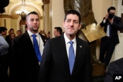 House Speaker Paul Ryan of Wis., center, leaves the House Chamber after voting on the Republican tax bill, Dec. 19, 2017, on Capitol Hill in Washington.