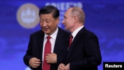 資料照片：中國國家主席習近平和俄羅斯總統普京在聖彼得堡出席國際經濟論壇會議期間。 （2019年6月7日）