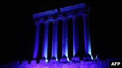 FILE - Part of the temples of Baalbek, a UNESCO world heritage site in Lebanon's eastern Bekaa Valley, illuminated in blue light, Oct. 24, 2015.
