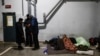 Migrants rest at the transport and logistics centre Bruzgi on the Belarusian-Polish border, in the Grodno region, Belarus, Dec. 21, 2021. 