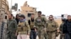Syrian Democratic Forces and U.S. troops are seen during a patrol near Turkish border in Hasakah, Syria, Nov. 4, 2018.