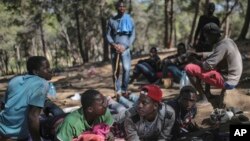 Sub-Saharan migrants aiming to cross to Europe take shelter in a forest overlooking the neighborhood of Masnana, on the outskirts of Tangier, Morocco, Sept. 5, 2018.