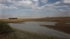 FILE - Taps and water sources are dry in South Africa's almost depleted local dam in Senekal, Jan. 7, 2016. Senekal, a small town in South Africa’s rural Free State province, is one of four regions declared disaster areas as drought dries up the country's heartland.
