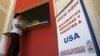 FILE - A woman makes a transaction at a remittance office in Nacaome, south of Tegucigalpa, Nov. 12, 2008. 