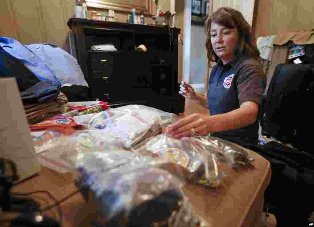 Rendi Murphree, an epidemiologist with the Centers for Disease Control and Prevention packs for her trip to Monrovia, Liberia, at her home in Nashville, Tennessee, Sept. 5, 2014. 