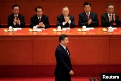 Chinese President Xi Jinping walks to deliver his speech during the opening of the 19th National Congress of the Communist Party of China at the Great Hall of the People in Beijing, China October 18, 2017.