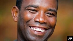 FILE - Guy Philippe laughs during an interview in Pestel, Haiti, Aug. 24, 2016.