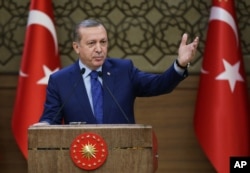 FILE - Turkish President Recep Tayyip Erdogan addresses a meeting of local administrators at his palace in Ankara, March 16, 2016.