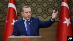 FILE - Turkish President Recep Tayyip Erdogan addresses a meeting of local administrators at his palace in Ankara, March 16, 2016. Ties between the Israel and Turkey broke down in 2010 over Israel's interception of a Turkish aid ship bound for Gaza.