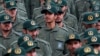 In this Feb. 11, 2019 file photo, Iranian Revolutionary Guard members attend a ceremony celebrating the 40th anniversary of the Islamic Revolution, at the Azadi, or Freedom, Square in Tehran, Iran.