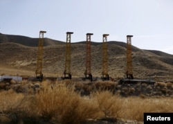 FILE - Equipment and machines installed by Chinese excavators are seen near a copper mine in Mes Aynak, Logar province. Feb. 14, 2015.
