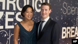 FILE - Priscilla Chan and Mark Zuckerberg are expecting a baby girl.