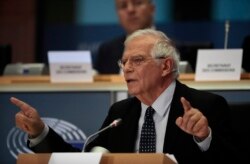 FILE - Spanish Foreign Minister Josep Borrell answers questions at the European Parliament in Brussels, Oct. 7, 2019.