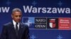 U.S. President Barack Obama listens to Polish President Andrzej Duda offering condolences before making statements following their meeting at PGE National Stadium in Warsaw, Poland, July 8, 2016. 