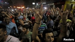 FILE - Protesters gather in central Cairo shouting anti-government slogans in Cairo, Egypt, Sept. 21, 2019.