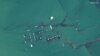 FILE - A satellite image shows flooded homes near the Uzbekistan-Kazakhstan border following the collapse of the Sardoba dam in Uzbekistan, May 3, 2020. 