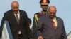 Sudan President Omar al-Bashir, right, arrives in Kigali, Rwanda, July 16, 2016, to attend an African Union summit. He defied an international arrest warrant after public assurances from Rwandan leaders that he would not be arrested. He is wanted by the ICC for alleged atrocities in his country's Darfur region.