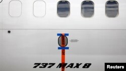 FILE PHOTO: A seal is seen on Garuda Indonesia's Boeing 737 Max 8 airplane parked at the Garuda Maintenance Facility AeroAsia, at Soekarno-Hatta International airport near Jakarta, Indonesia, March 13, 2019. REUTERS/Willy Kurniawan/