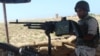 FILE - An Egyptian army soldier looks on from his postion at a checkpoint in el-Arish city, the troubled northern part of the Sinai Peninsula, July 8, 2015.