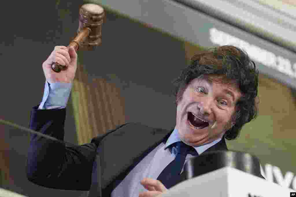 Argentina's President Javier Milei poses for pictures after ringing the opening bell at the New York Stock Exchange in New York.
