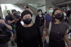 Bao Choy Yuk-Ling, a freelance producer with RTHK, leaves West Kowloon Magistrates' Courts after being found guilty of making false statements to obtain data for a documentary, in Hong Kong, China April 22, 2021.